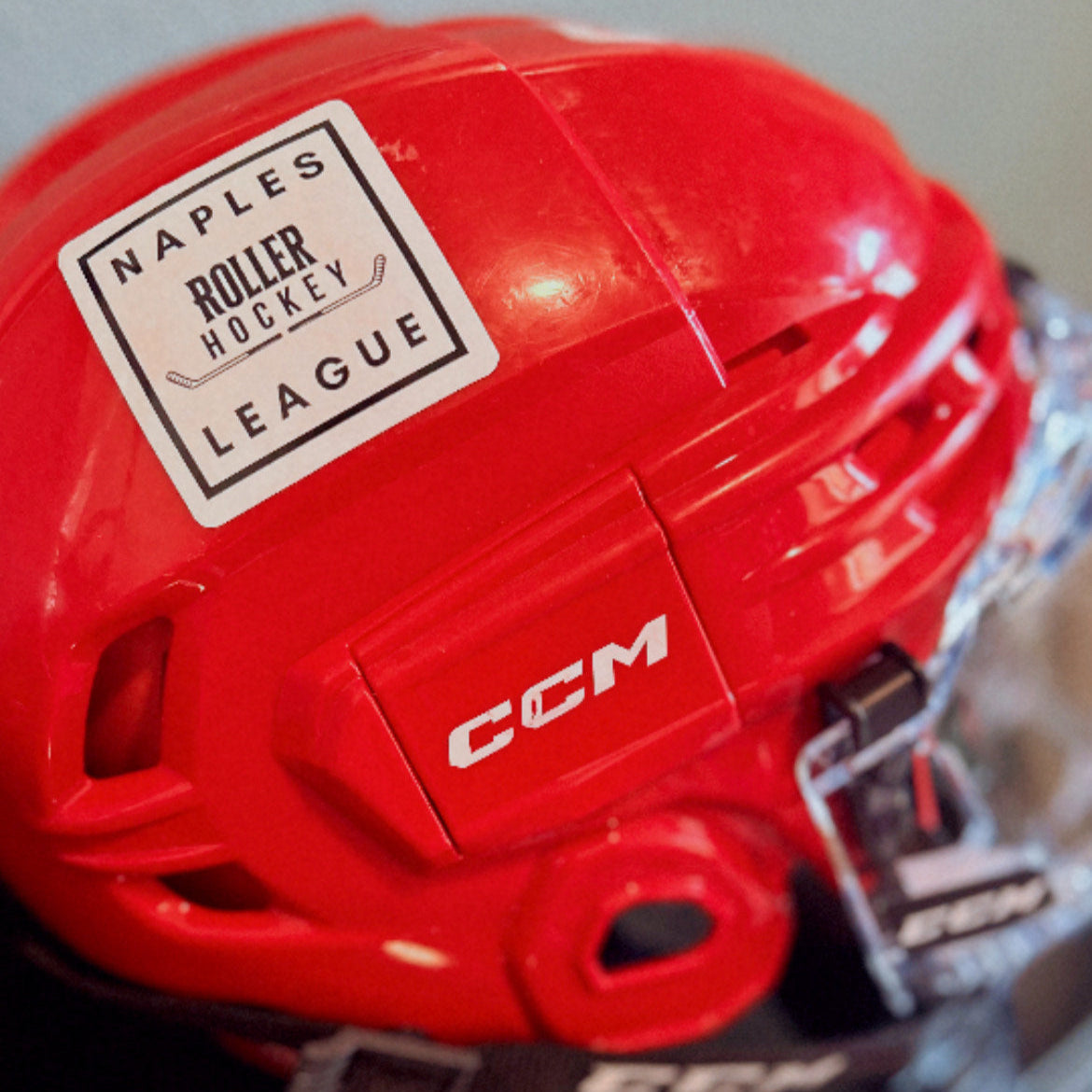 Naples Roller Hockey League sticker on hockey helmet